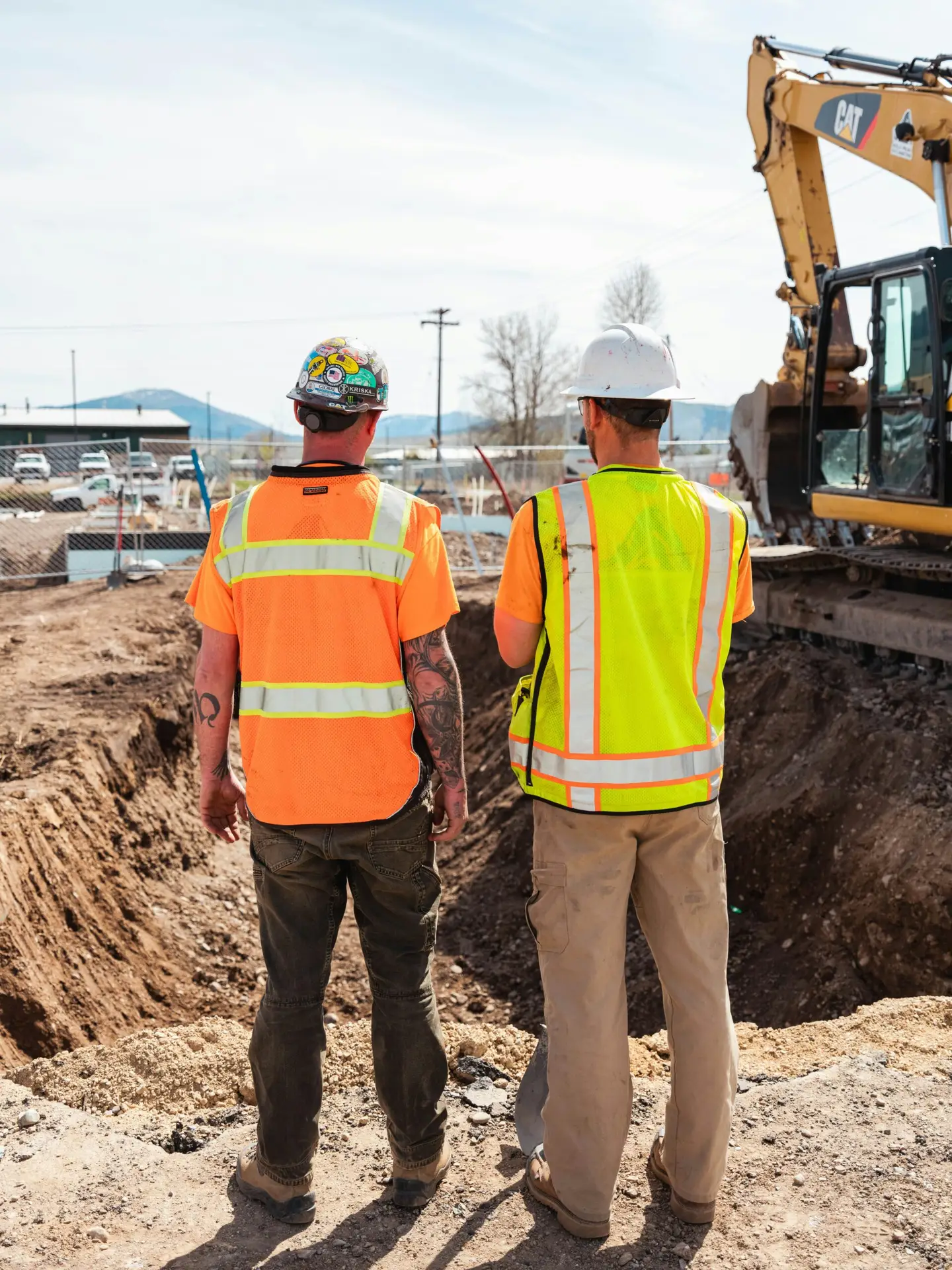 Custom embroidered crew hats and branded workwear produced by FOX Merch for construction teams